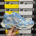 Blue and white lace-up athletic sneaker with textured panels and chunky sole