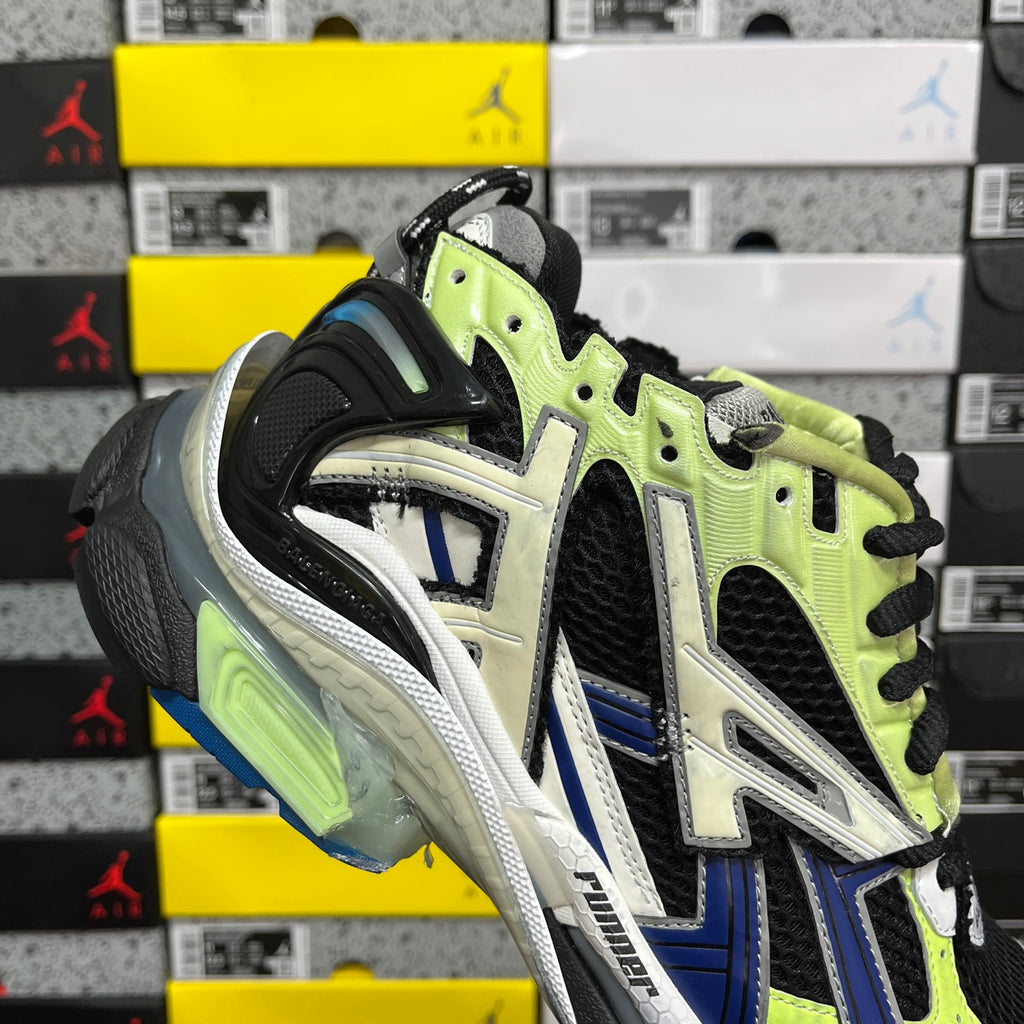 Balenciaga unisex running sneaker heel side: neon green panels, black mesh, and white detailing