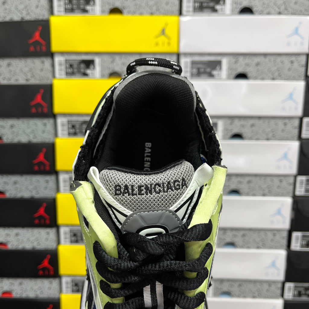 Balenciaga unisex running sneaker heel with black upper, neon green collar, and BALENCIAGA text