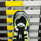 Balenciaga unisex running sneaker view from toe: neon green and black with perforated panels