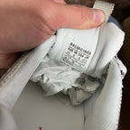 Balenciaga size label inside white sneaker collar, showing EU/UK/US sizing info.