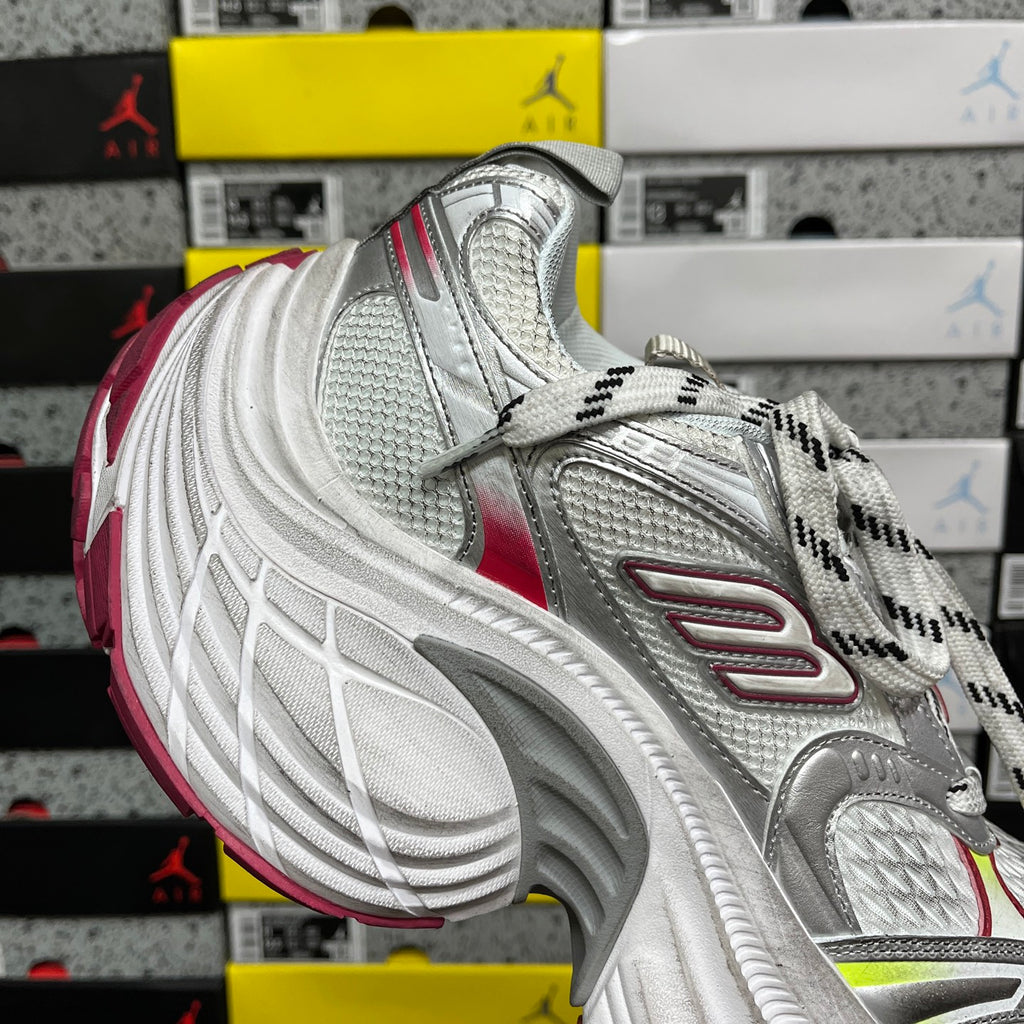 Silver mesh athletic sneaker with red accent stripe and patterned side overlays.
