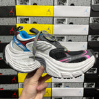 Balenciaga unisex chunky sneaker, angled side view with blue detail and gray sole