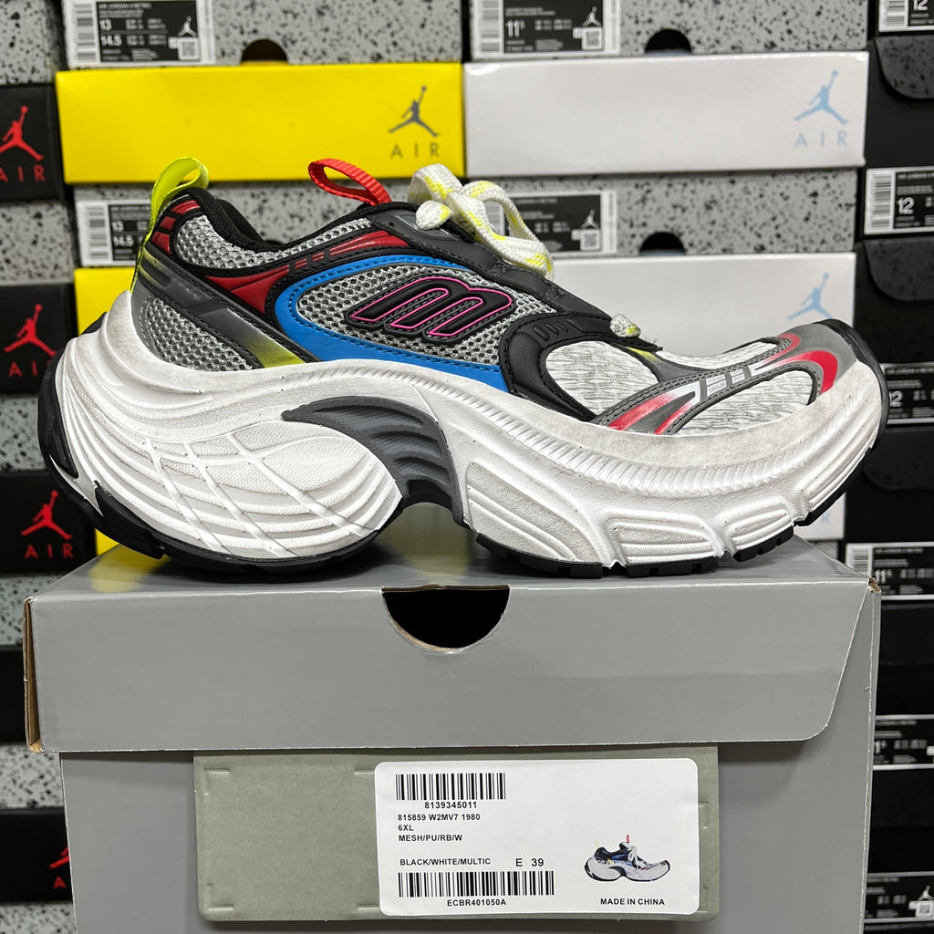 Balenciaga unisex chunky sneaker, side view with blue inset and multicolor laces