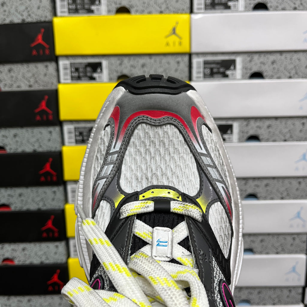 Balenciaga unisex chunky sneaker, front view with gray mesh and neon yellow laces