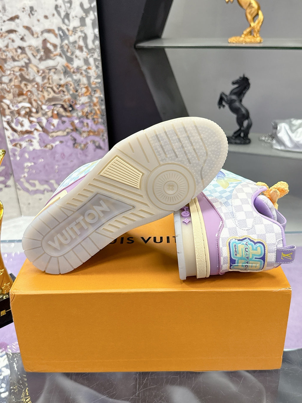 Louis Vuitton ladies sneakers, outsole view on box with checkered uppers and yellow laces