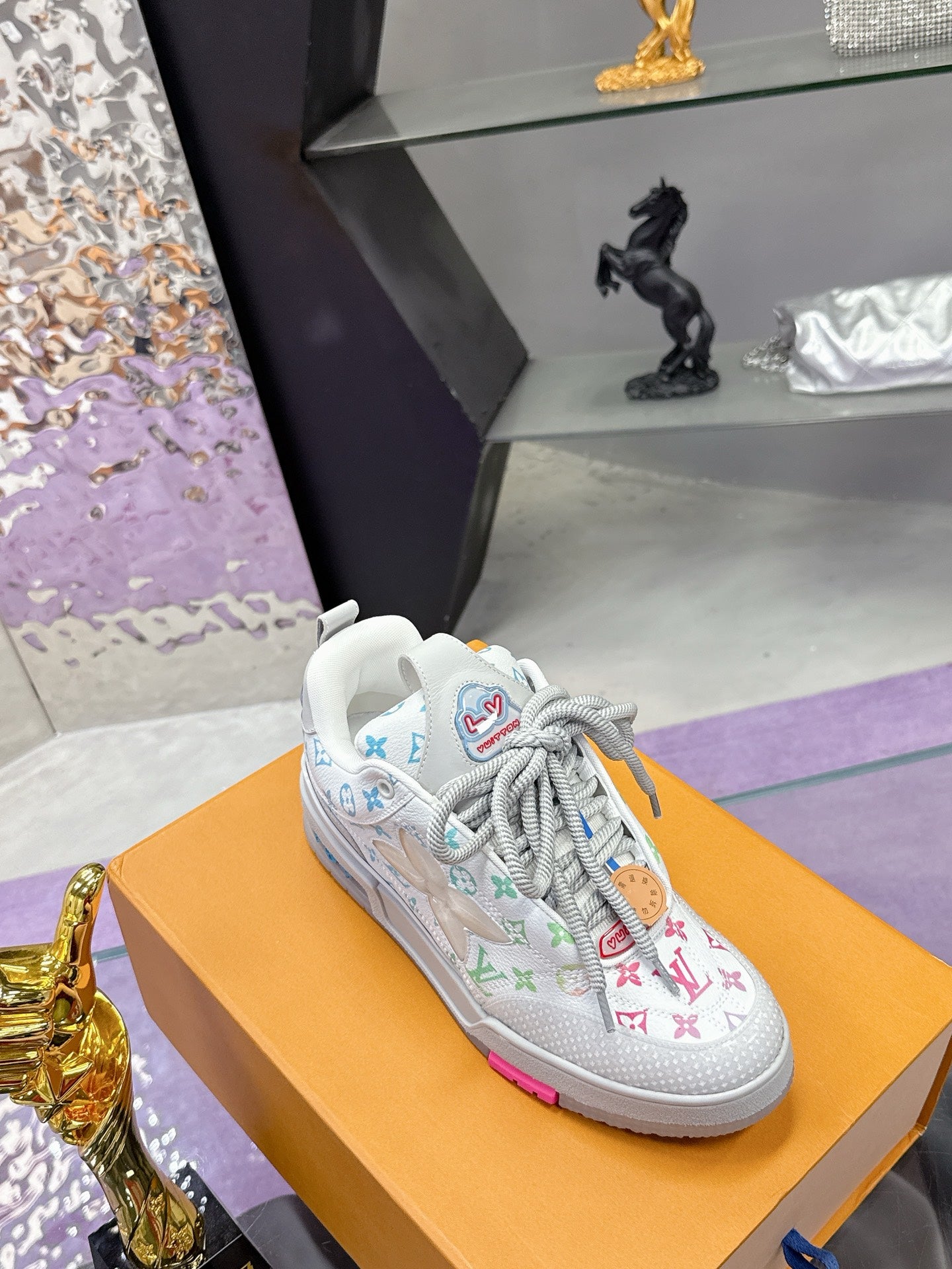 Louis Vuitton ladies sneakers, white with multicolor monogram pattern and cushioned sole