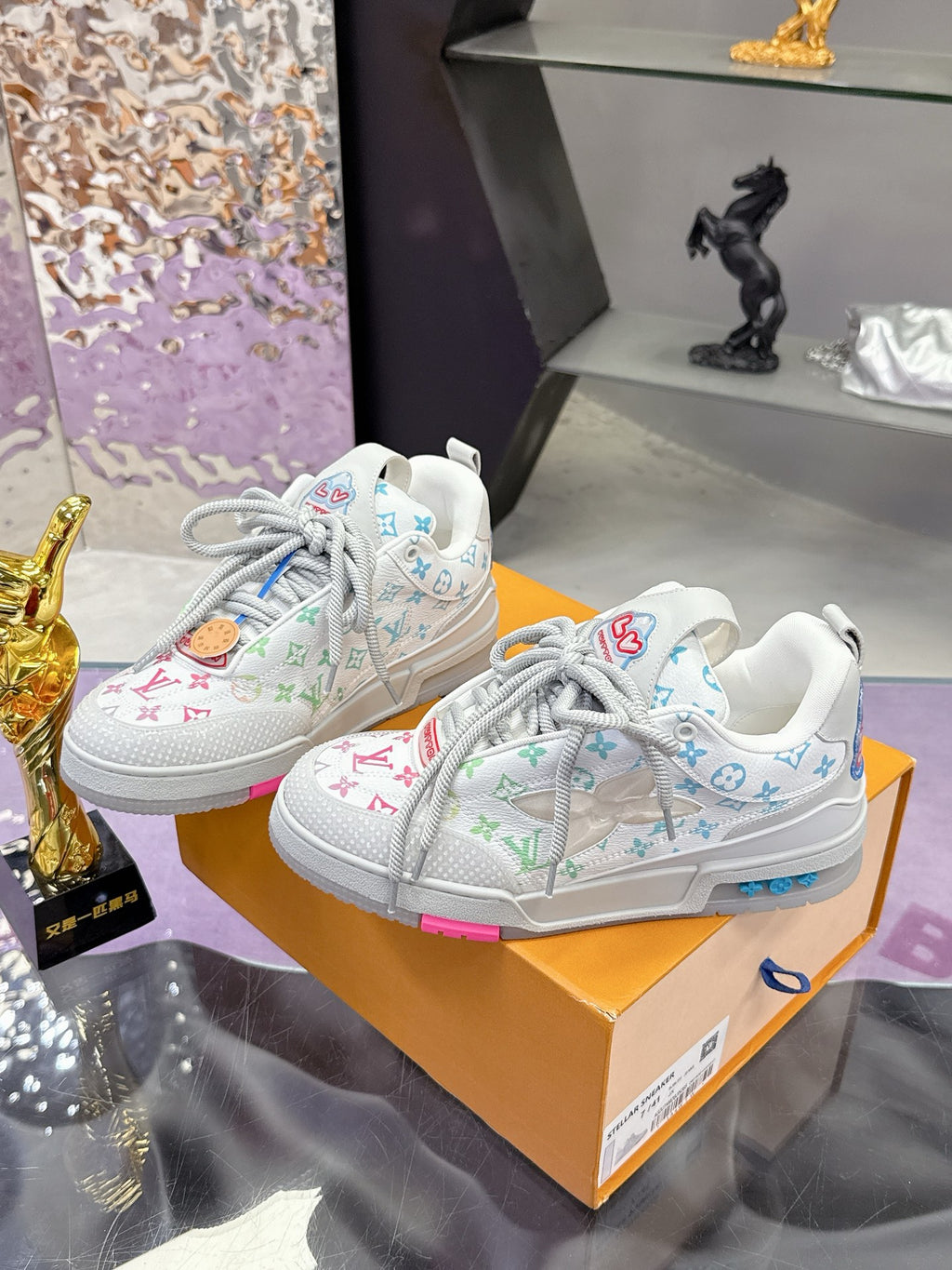 Louis Vuitton ladies sneakers pair, white with multicolor monogram pattern and gray laces