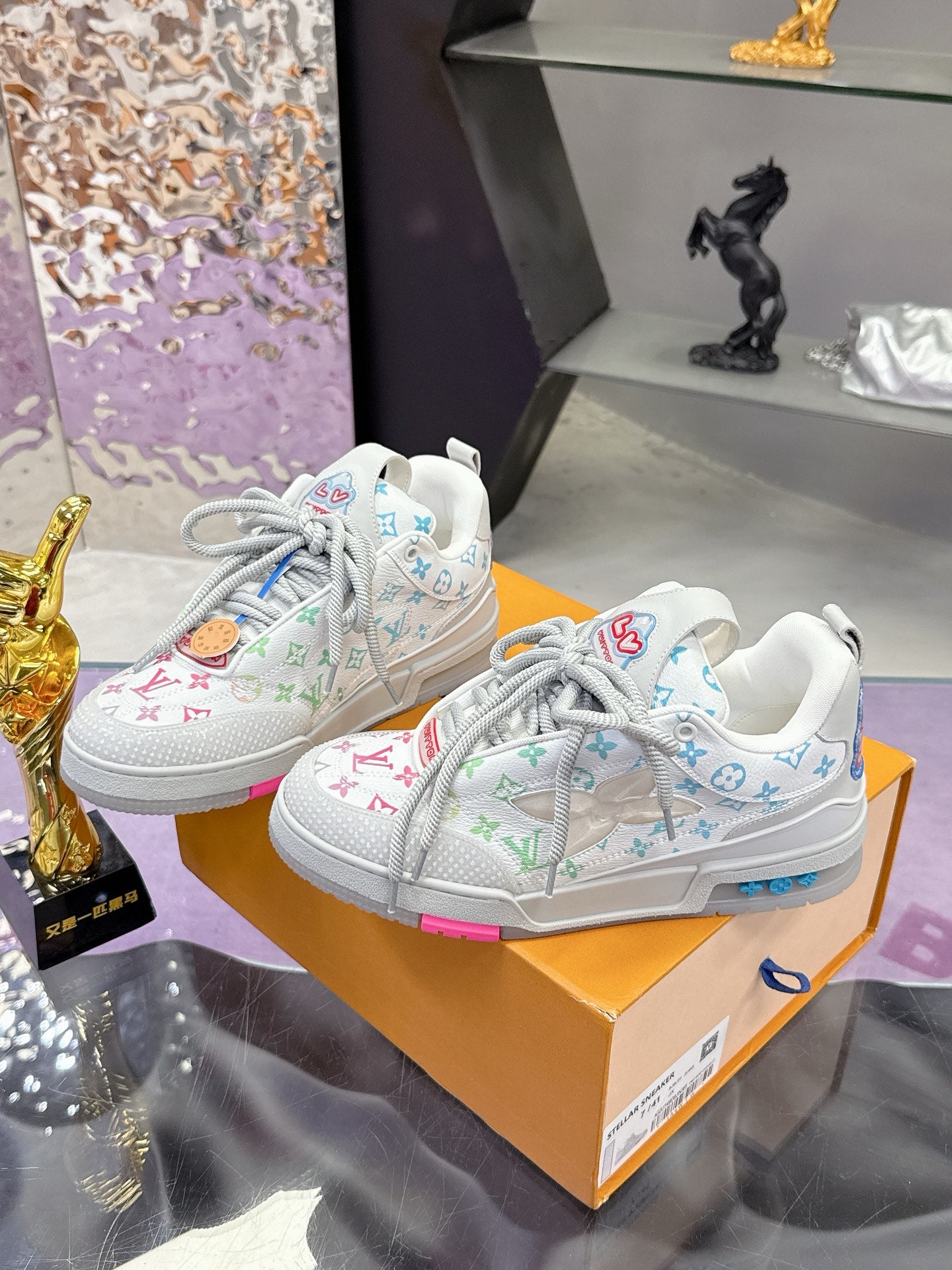 Louis Vuitton ladies sneakers pair, white with multicolor monogram pattern and gray laces