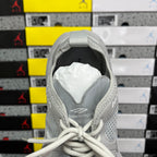 Light gray mesh sneaker heel opening with white laces and Balenciaga detail