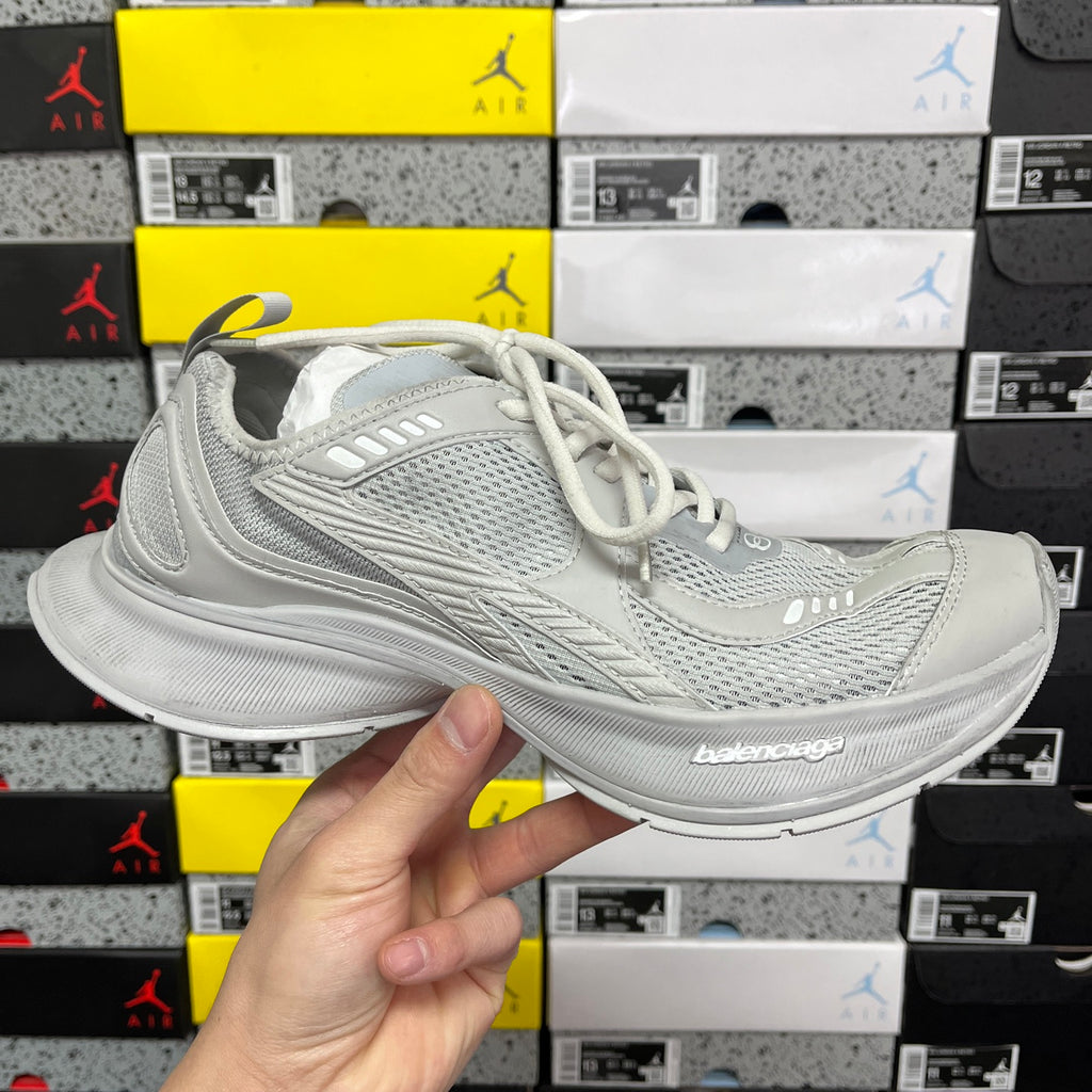 Light gray mesh sneaker with white laces and chunky cushioned sole