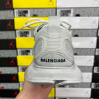 Light gray mesh Balenciaga sneaker heel with black text logo on back