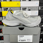 Light gray mesh Balenciaga sneaker on box; side view with white laces