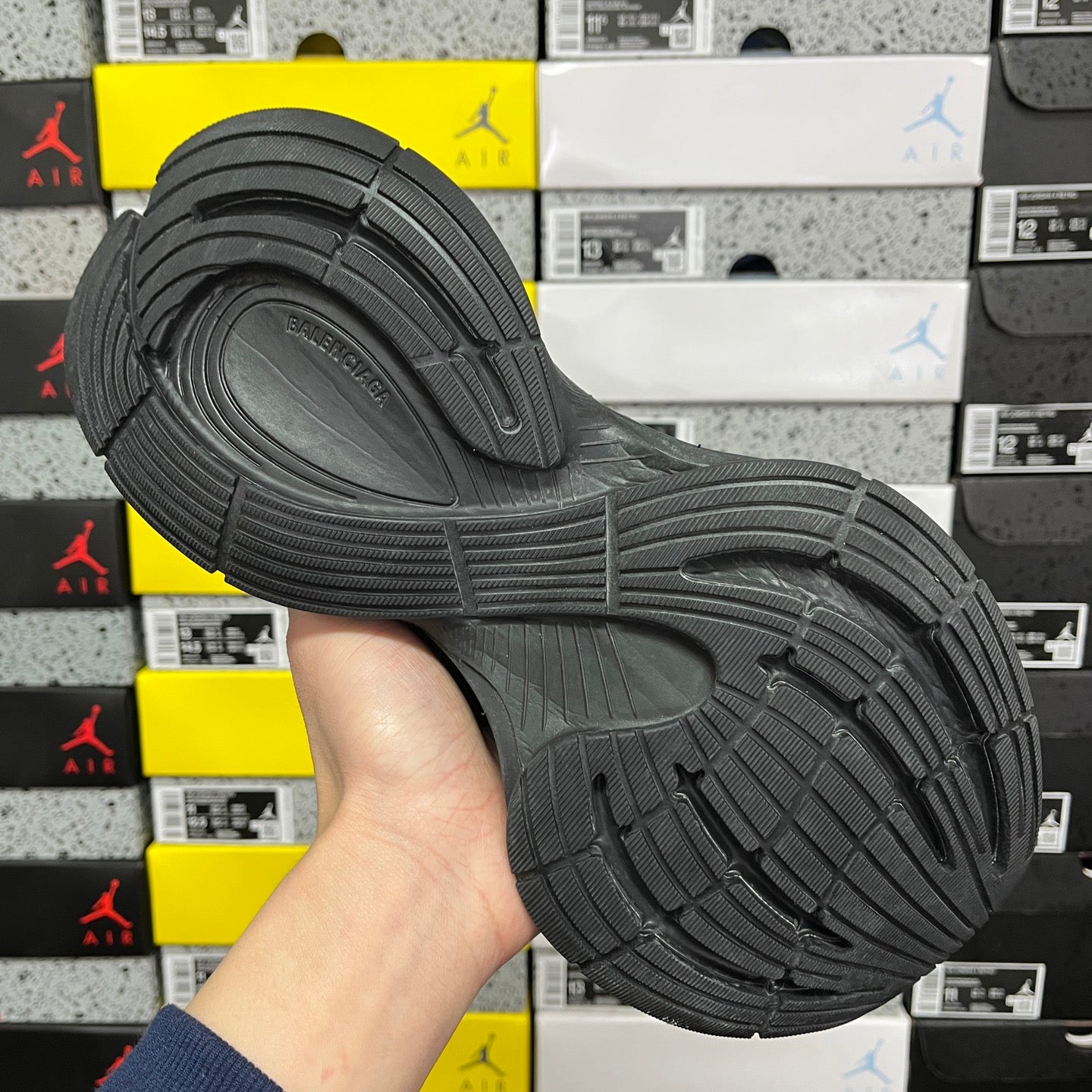 Black Balenciaga unisex sneaker outsole, textured tread pattern and curved grip