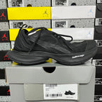 Black Balenciaga unisex sneaker, side view with lace-up mesh and ridged sole