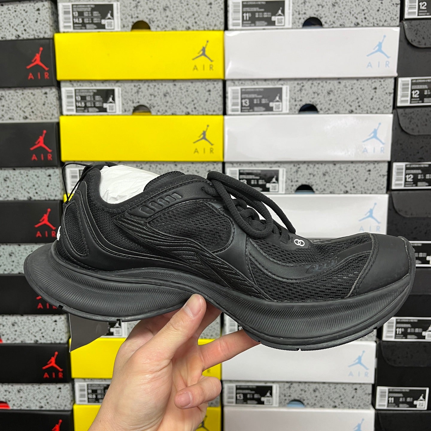 Black Balenciaga unisex sneaker, profile view with lace-up and cushioned midsole