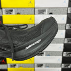 Black Balenciaga unisex sneaker, angled side with branded midsole and mesh texture