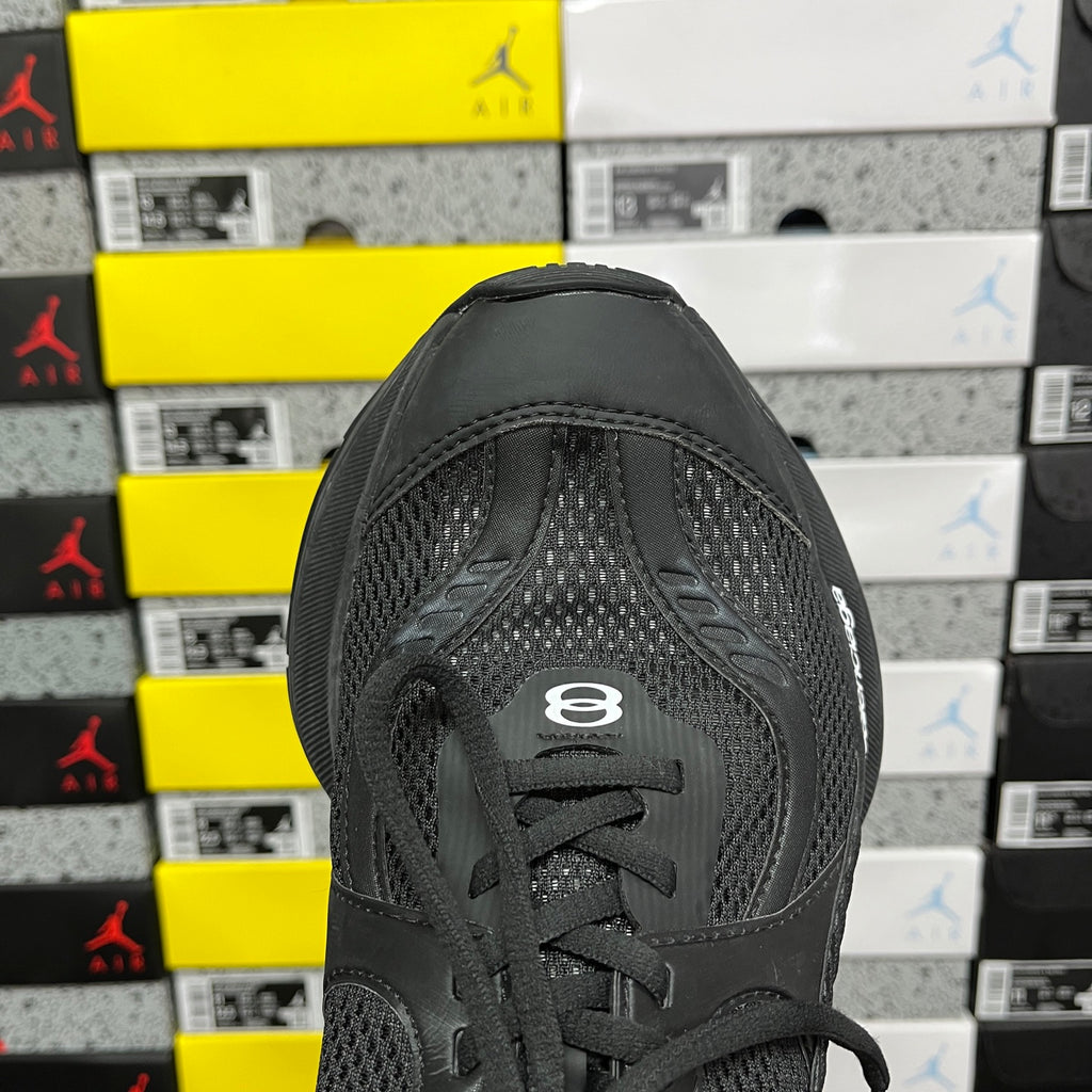Black Balenciaga unisex sneaker, rear quarter view with lace-up and mesh heel
