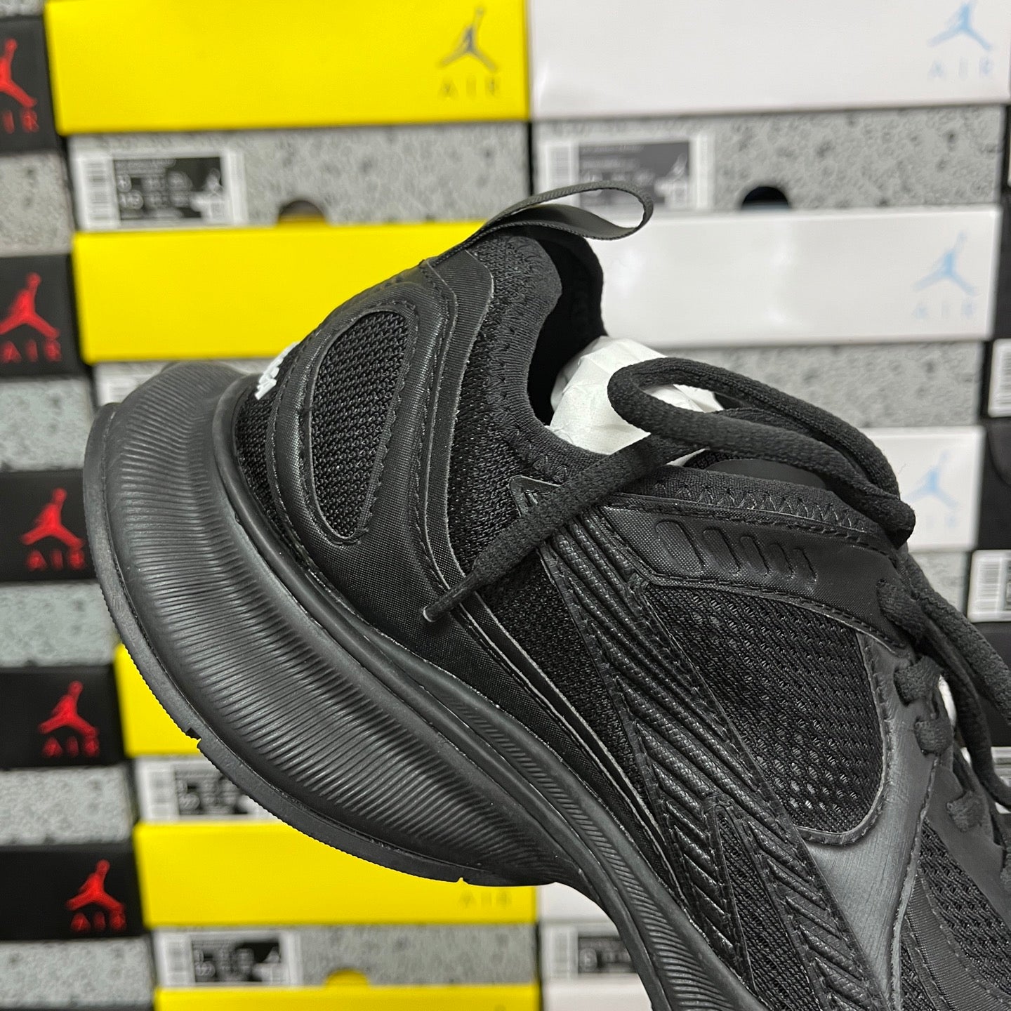 Black Balenciaga unisex sneaker, toe and lace-up with layered panel detailing