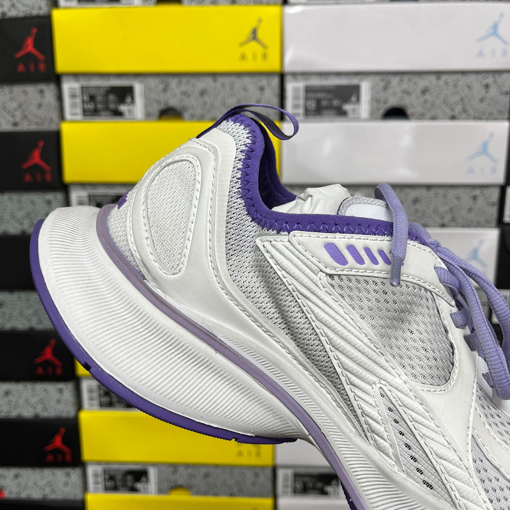 Unisex white sneaker with purple collar and textured side panel