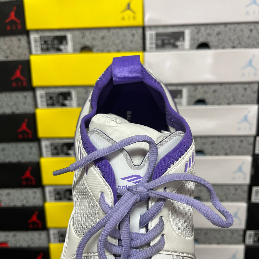 Unisex white sneaker with purple tongue and padded heel lining