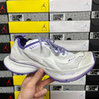 Unisex white sneaker with purple laces and side logo detail