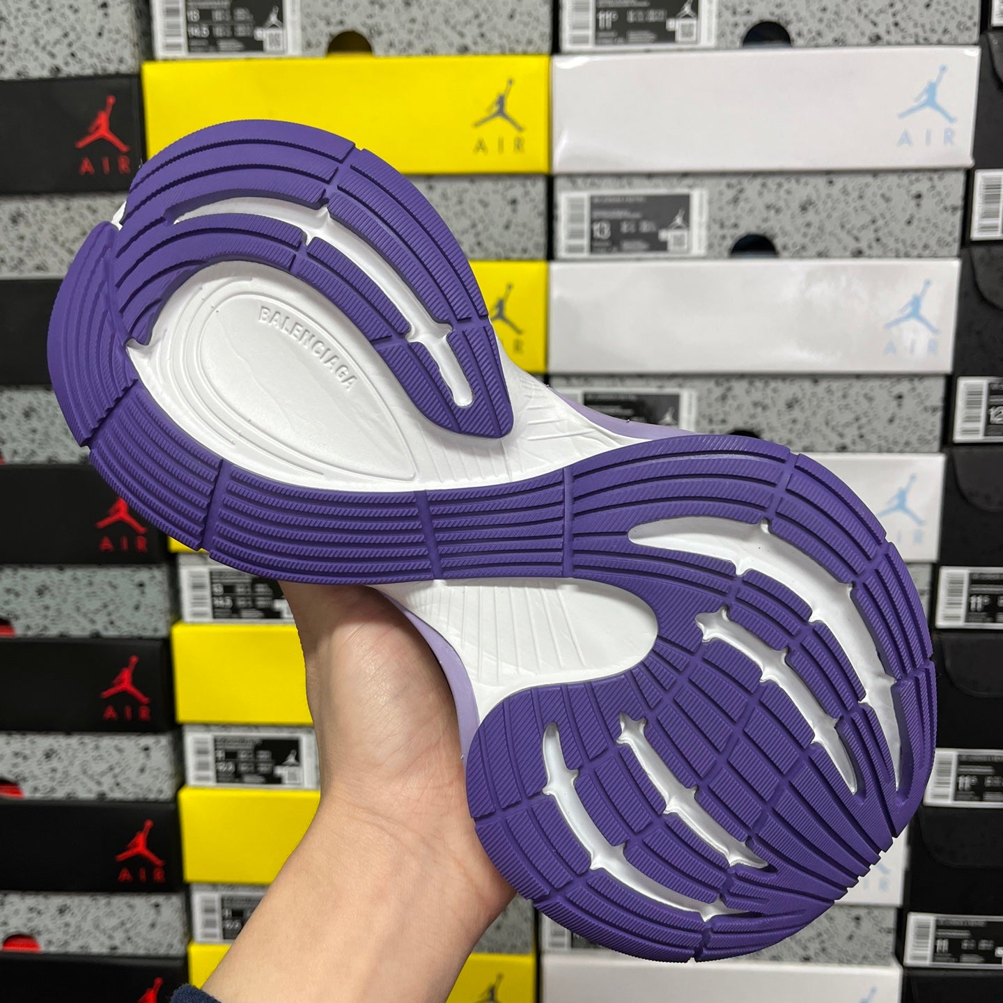 Unisex sneaker outsole with purple traction tread and white midsole