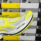 Side view of lime green and white Balenciaga sneaker with sculpted sole