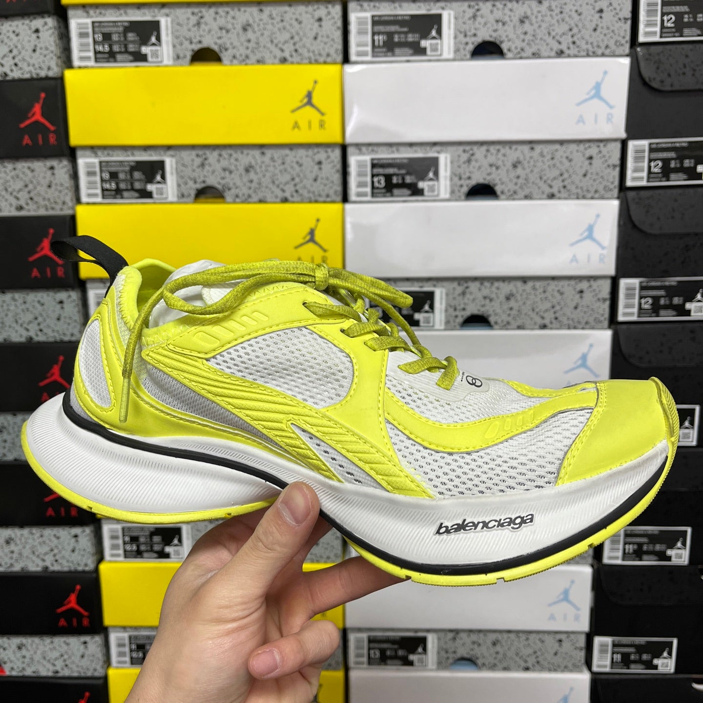 Lime green and white Balenciaga unisex sneaker with mesh panels and neon laces