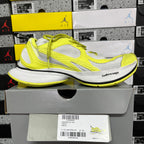 Lime green and white Balenciaga sneaker with chunky white sole and lace-up front