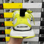 Heel of lime green and white Balenciaga sneaker with BALENCIAGA logo on back