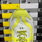 Front view of lime green and white Balenciaga sneaker with lace-up eyelets
