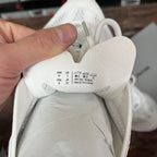 White sneaker inner size label: EU 41, UK 7, USA 8; made in China