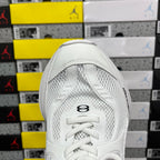 White Balenciaga sneaker toe with lace-up closure and textured mesh panels