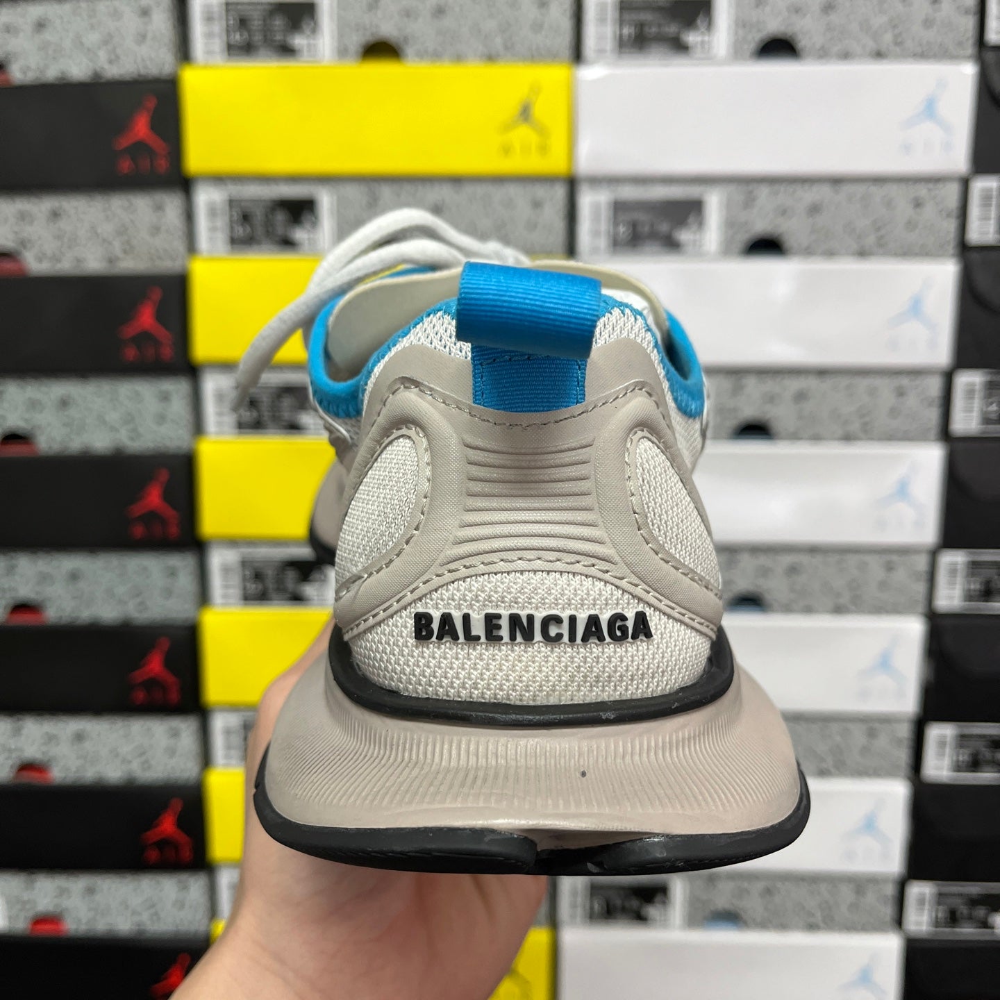 Balenciaga unisex sneakers in light beige with BALENCIAGA text on heel, back view