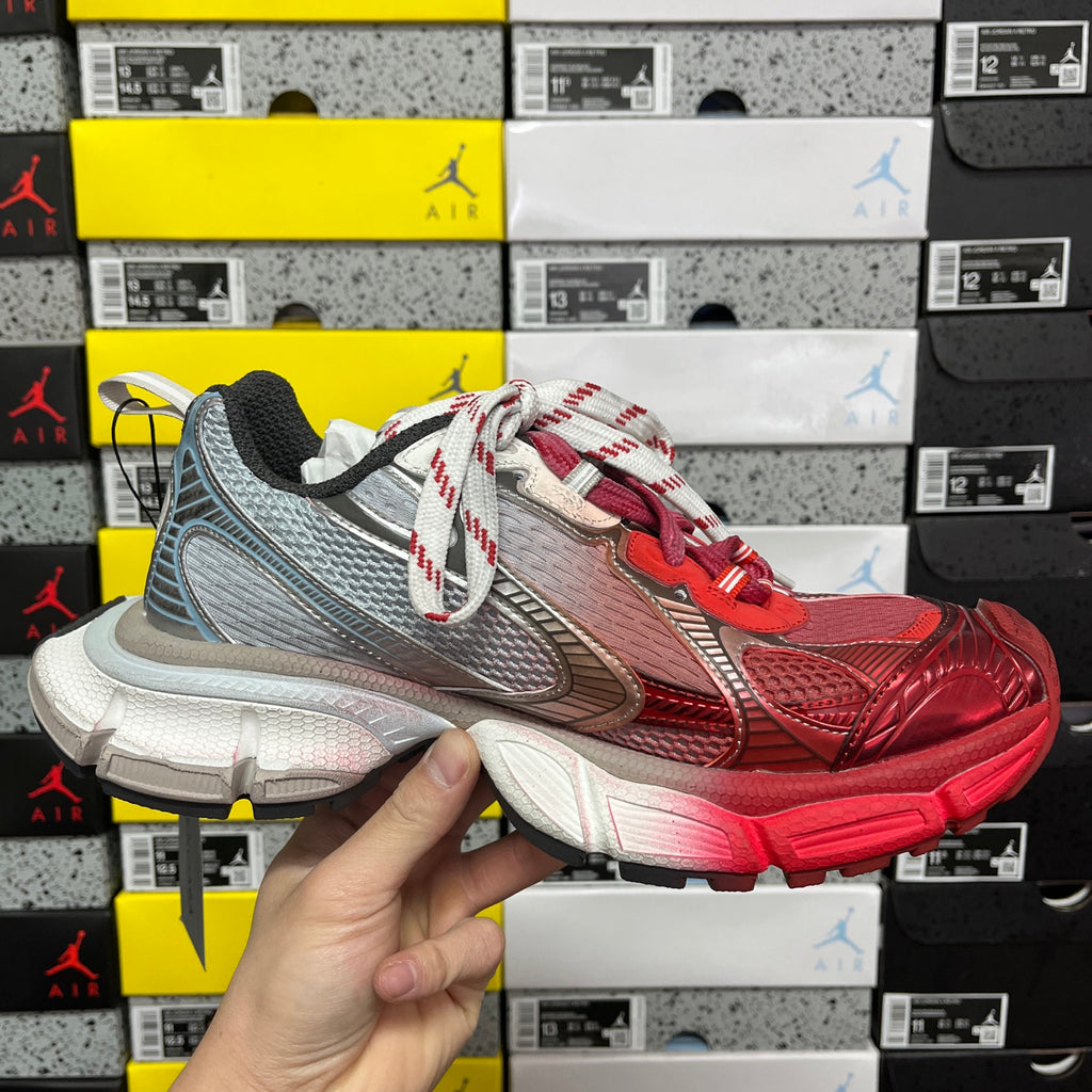 Red and gray Balenciaga runner sneaker front view with white-red laces and rocker sole