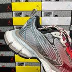 Blue-gray Balenciaga runner sneaker with black collar and white-red laces