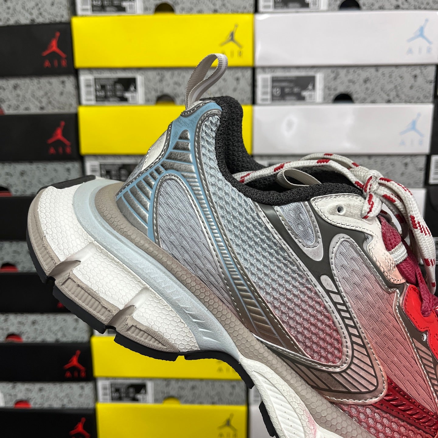 Blue-gray Balenciaga runner sneaker with black collar and white-red laces
