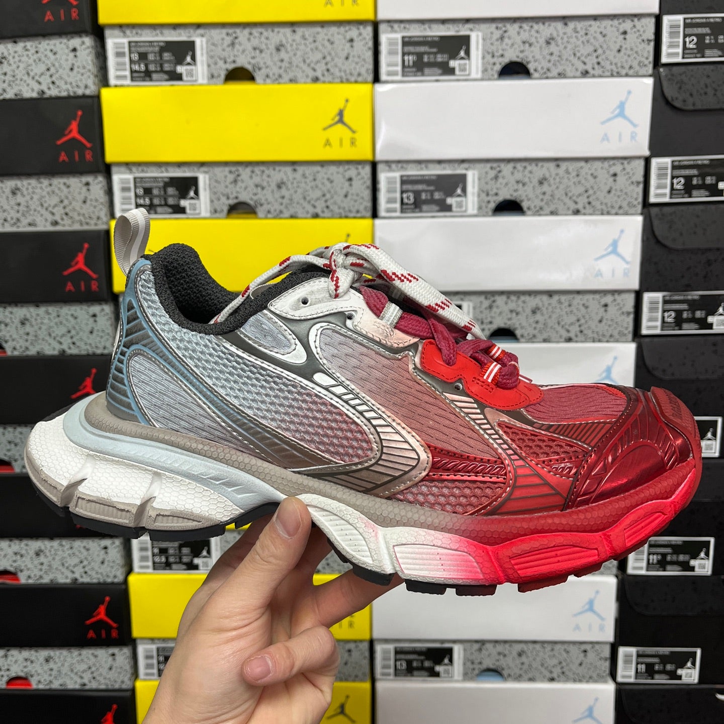Red and gray Balenciaga runner sneaker with white laces and chunky sole