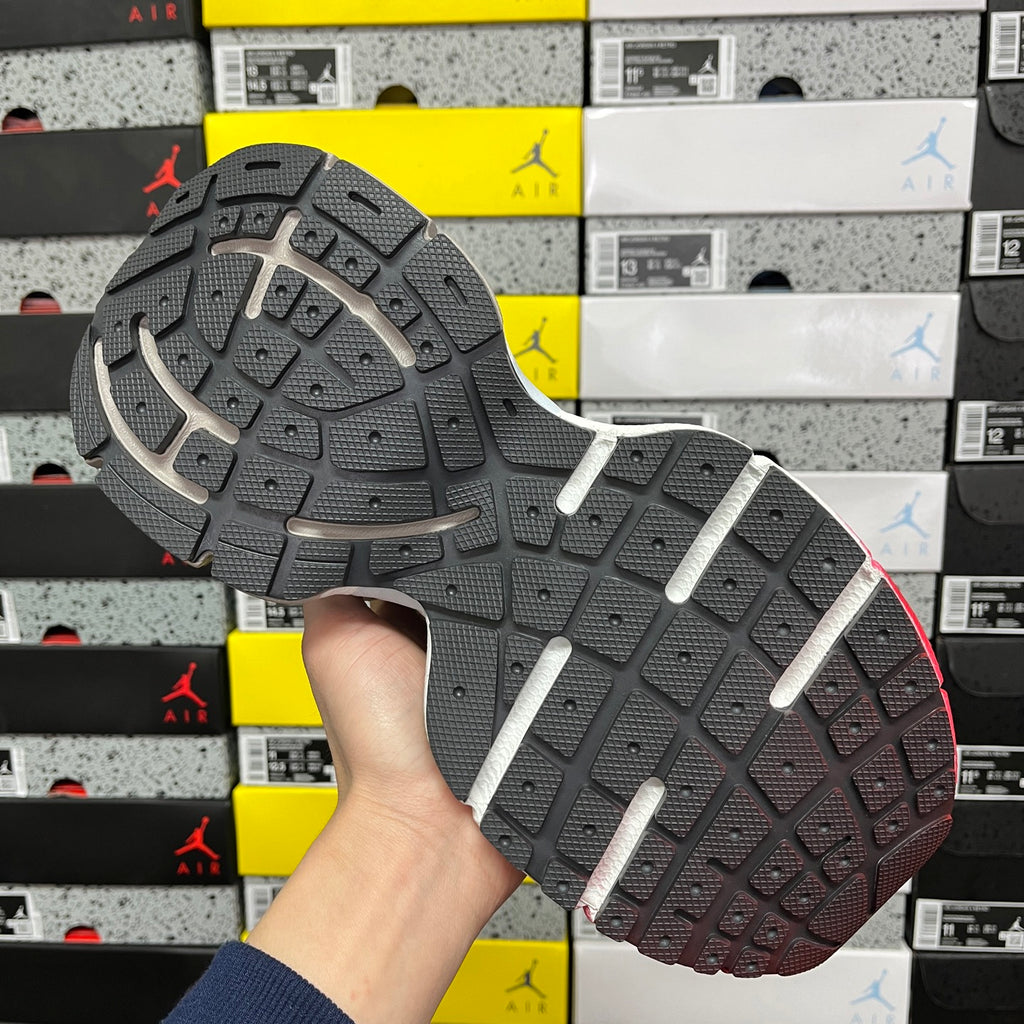 Balenciaga runner sneaker outsole with patterned tread and gray sidewall
