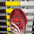 Red Balenciaga runner sneaker tongue and lacing detail with textured upper