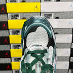 Runner sneaker heel opening with white lining and green lace tie detail, close-up.