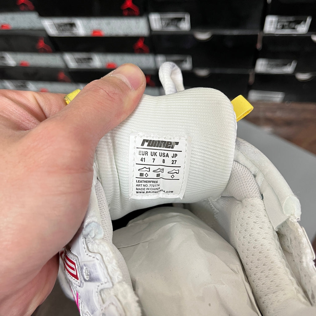 White sneaker interior label with size and Runner text, fabric lining close-up
