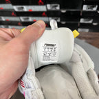 White sneaker interior label with size and Runner text, fabric lining close-up