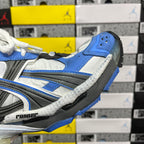 Balenciaga unisex sneaker side detail with blue, white, and gray panels and textured trim