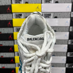 White sneaker upper with 'BALENCIAGA' on padded collar and lace-up closure.