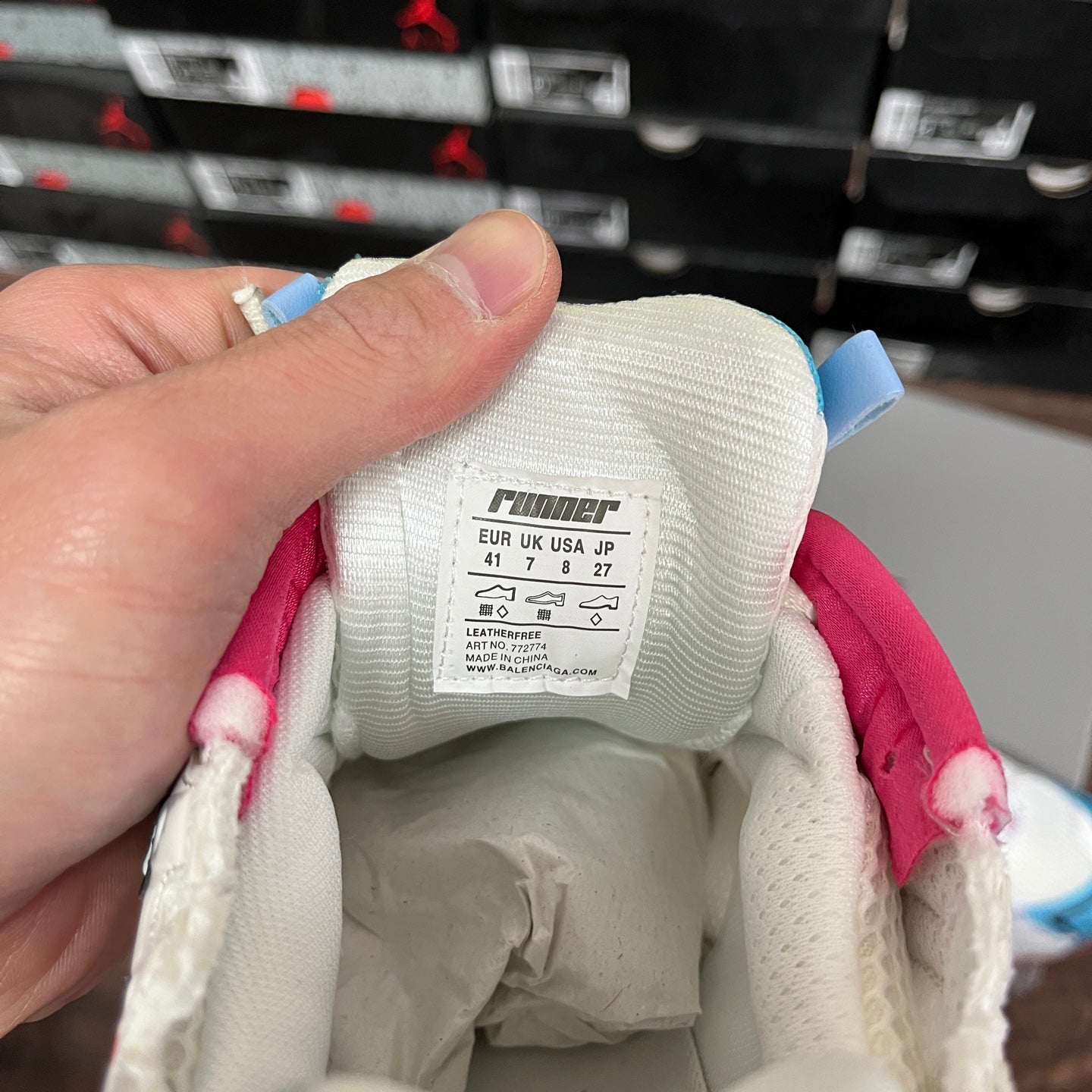 Inside size label on white Balenciaga runner sneaker, size 41