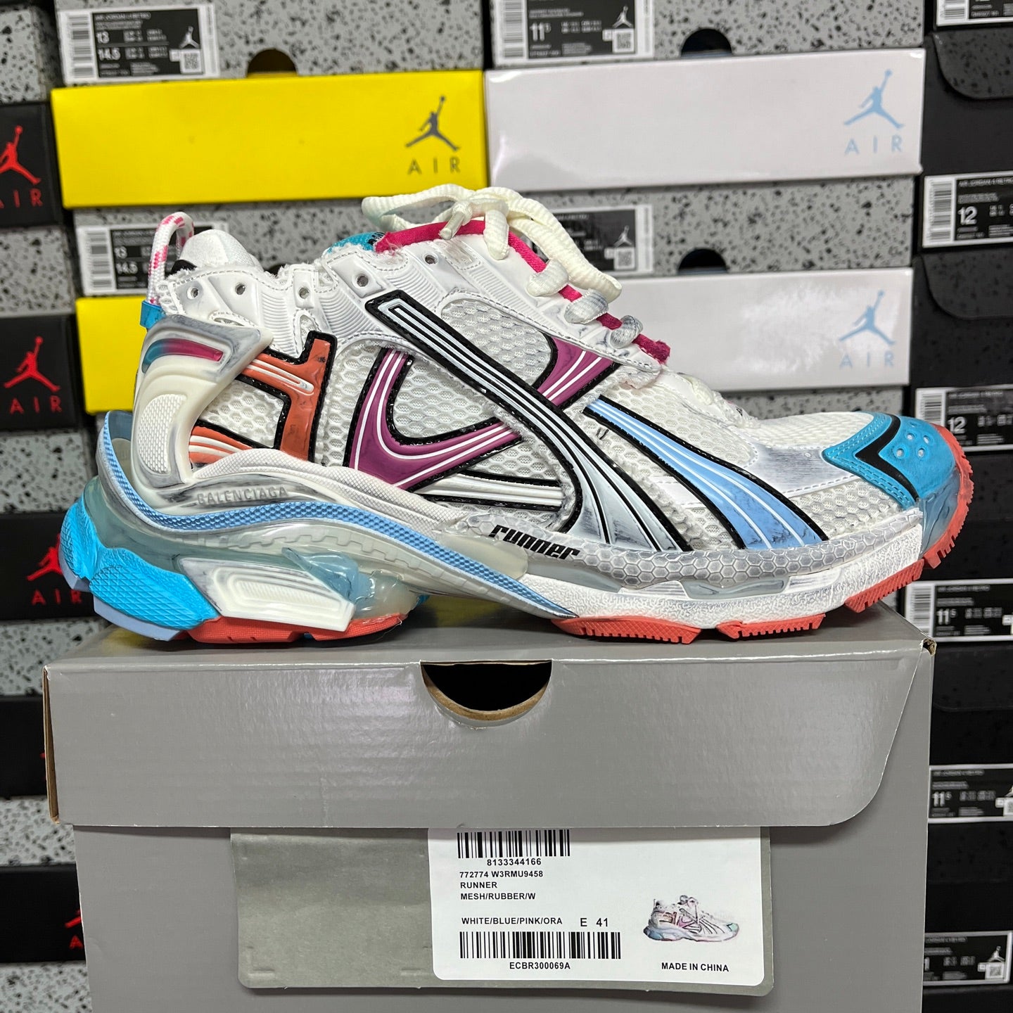 White Balenciaga runner sneaker in box, blue and red heel detailing