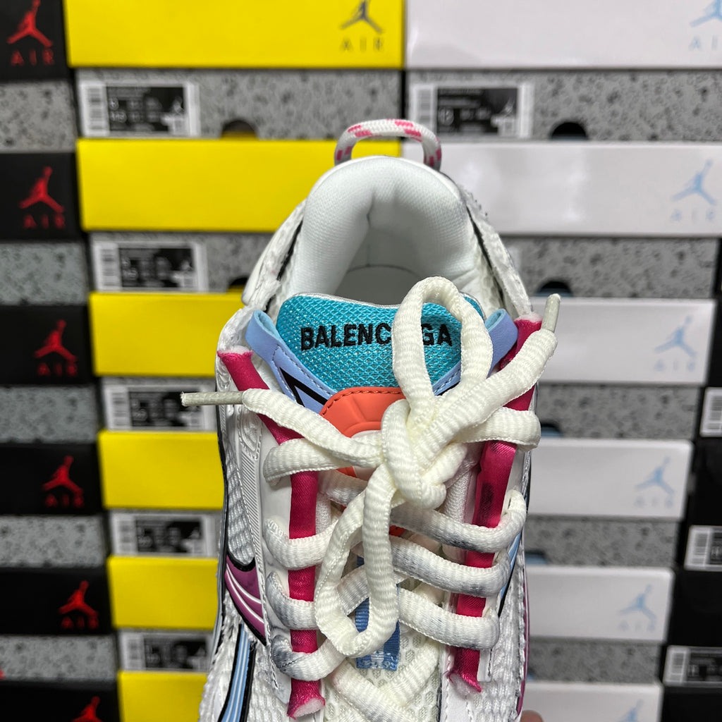 White Balenciaga runner sneaker back view with blue tongue lining and pink laces