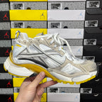 White and metallic Balenciaga unisex sneaker with yellow sole and front lace panel